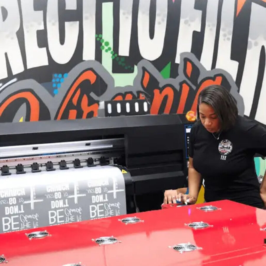 DTF transfer printer running a sheet at DTF Virginia